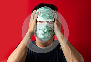 Sick man with mask touch head, fear virus Infect