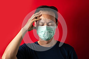 Sick man with mask touch head, virus Infect photo