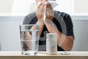 Sick MAN medicines for sick pills spilling out of bottle