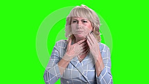 Sick mature woman on green screen.