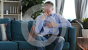 Sick Middle Aged Man Sitting and Coughing, Cough Infection