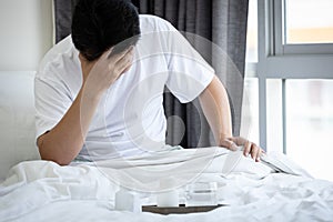 Sick middle aged man suffering from tension headache,problem of chronic daily headache from medication overuse headache,asian male