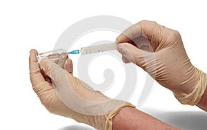 Sick nurse hands in rubber gloves are withdrawing medicine on white background