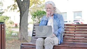 Sick Old Man Coughing while Using Laptop Outdoor