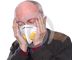 Sick old man. Senior man in mask suffering from headach over white background photo