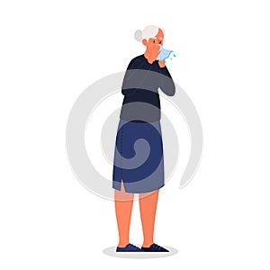 Sick old woman with runny nose a symptom of flu, cold or allergy