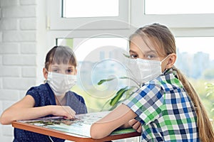 Sick quarantined children play a board games photo