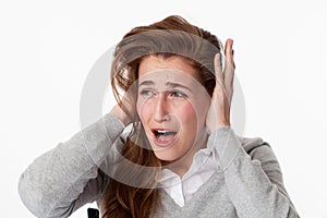 Sick 20s woman suffering from tinnitus, shouting for peace photo