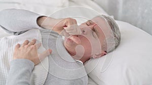 Sick Senior Old Man Sleeping in Bed and Coughing