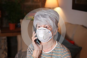 Sick senior woman calling by phone