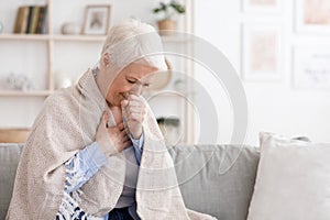 Sick Senior Woman Covered In Blanket Coughing Hard At Home