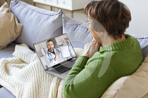 Sick senior woman at home during online cousultation with a doctor.