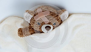 Sick teddy bear toy with patch