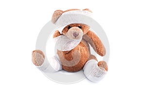 Sick teddy bear wrapped in bandages
