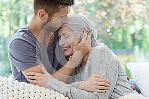 Sick woman being kissed photo