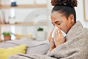 Sick, woman and blowing nose with blanket in home from hayfever allergies, cold and winter virus. Face, tissue and black