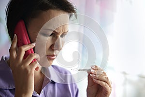 Sick woman calling to the doctor