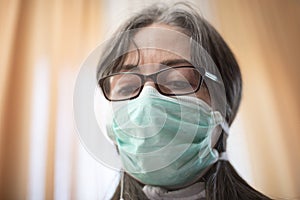 Sick woman of corona wears a protective mask