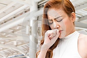 Sick woman coughing, sore throat