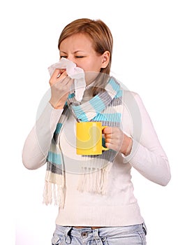 Sick woman with cup of tea sneezing in tissue isolated photo