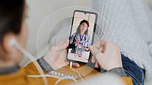 Sick woman doing video call with doctor