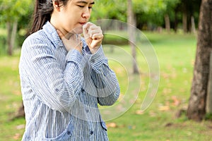 Sick woman feeling bad suffering from sore throat,painful swallowing,asian female patient have coughing,irritation and sore throat photo
