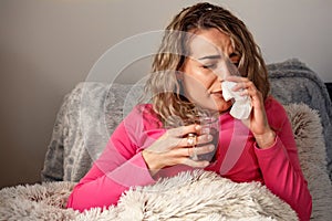 Sick Woman. Flu. Woman Caught Cold. Sneezing into Tissue. Headache. Virus..