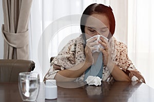 Sick Woman.Flu.Woman Caught Cold. Sneezing into Tissue. Headache. Virus