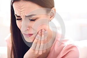 Sick woman having a toothache photo