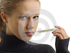 Sick woman holding thermometer