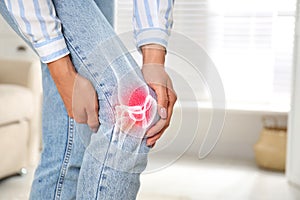 Sick woman at home, closeup. Digital compositing with illustration of knee joint