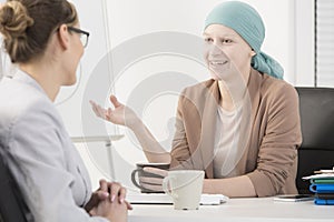 Sick woman meeting interviewer photo