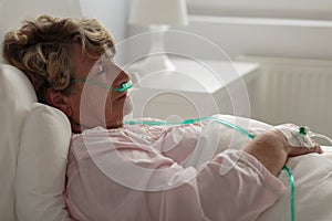 Sick woman with nasal cannula photo