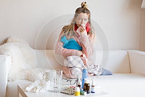 Sick woman sitting in sofa