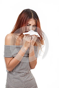 Sick woman sneezing due to flu, cold, allergy