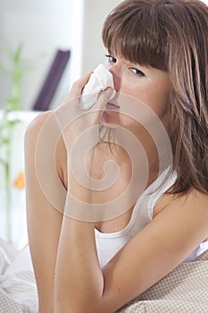 Sick woman sniffles