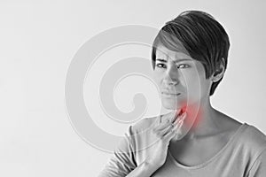 Sick woman with sore throat, inflammation photo