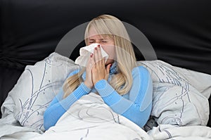 Sick woman suffering from hayfever or flu photo