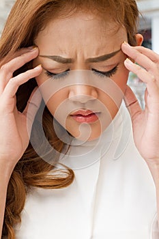 Sick woman suffers from headache, migraine, hangover, stress
