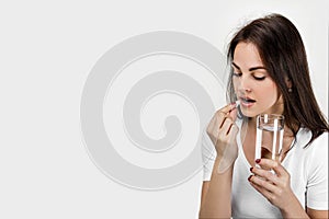 Sick woman taking pill painkiller medicine