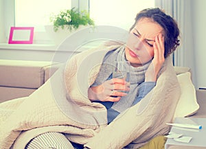Sick woman with thermometer. Flu photo