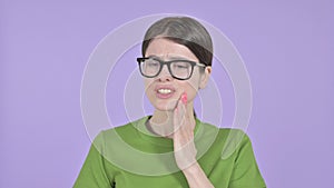 The Sick Young Woman having toothache on Purple Background