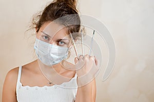 A sickly-looking woman and thermometers in her fist