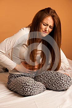 Sickness stomach ache pain period, woman suffering isolated over