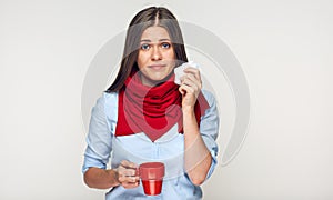 Sickness woman holding red cup blow up nose in paper tissue