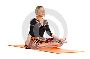 Siddhasana, a position in Yoga, is also called accomplished pose photo