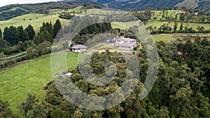 Side aerial view of beautiful country house photo