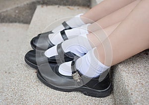 Side of Asian Thai girls schoolgirl student feet with black shoes