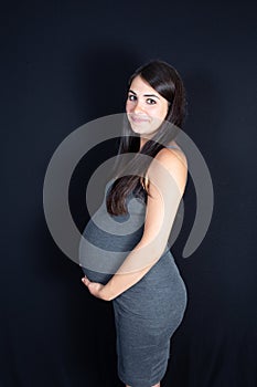 Side beautiful portrait of young pregnant woman Healthy pregnancy concept