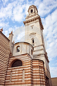 The side bell tower of Duomo Cattedrale di S. Maria Matricolare cathedral in Verona, Italy